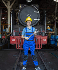 Portrait of Engineer train Inspect the train's diesel engine, railway track in depot of train
